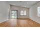 Bright open living room space with sliding glass doors and wood flooring at 97 Sarabeth St, Las Vegas, NV 89138
