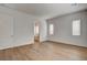 Bright empty main bedroom with wood flooring and a bathroom ensuite at 97 Sarabeth St, Las Vegas, NV 89138