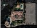 Stunning aerial view of estate showing layout with pool, courtyard, detached guest house and vacant lot at 9940 Orient Express Ct, Las Vegas, NV 89145