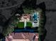 Aerial view of the luxury estate reveals outdoor kitchen, separate guest house, pool and jacuzzi at 9940 Orient Express Ct, Las Vegas, NV 89145