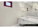Upstairs guest bathroom featuring modern vanity with marble countertop and a glass shower at 9940 Orient Express Ct, Las Vegas, NV 89145