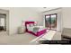 Bright guest bedroom showcasing a pink bed, modern nightstands, and access to a private balcony at 9940 Orient Express Ct, Las Vegas, NV 89145