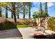 A dog run featuring a mature tree, artificial turf, and gated access to the rest of the yard at 9940 Orient Express Ct, Las Vegas, NV 89145