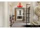 Elegant entry foyer featuring a statement chandelier and a view of the staircase at 9940 Orient Express Ct, Las Vegas, NV 89145