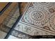 Close-up of an ornate mosaic floor design in the home's entry at 9940 Orient Express Ct, Las Vegas, NV 89145