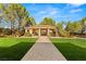 Paver walkway leads to manicured lawn and gazebo structure on immaculate grounds of this luxury estate at 9940 Orient Express Ct, Las Vegas, NV 89145