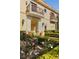Mediterranean-style home featuring a private balcony and stone archway at 9940 Orient Express Ct, Las Vegas, NV 89145