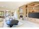 Bright Gathering room featuring fireplace, media center, and large windows offering great natural light at 9940 Orient Express Ct, Las Vegas, NV 89145