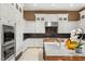 Gourmet kitchen features stainless steel appliances, granite countertops, and an island at 9940 Orient Express Ct, Las Vegas, NV 89145