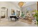 Open concept living room featuring high ceilings, tile floors, and comfortable seating at 9940 Orient Express Ct, Las Vegas, NV 89145