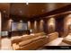 Home theater room with plush seating, large screen, and surround sound system at 9940 Orient Express Ct, Las Vegas, NV 89145