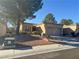 Inviting single-story home featuring low-maintenance landscaping and an attached two-car garage at 10101 Hemet Dr, Las Vegas, NV 89134