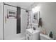 Bathroom features black hardware and white subway tile with black accents at 1100 H St, Las Vegas, NV 89106