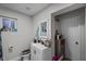 Bathroom with a white sink and cabinet, mirror, and walk in shower at 1100 H St, Las Vegas, NV 89106