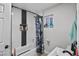 Bathroom with a shower featuring white subway tile, black trim and a shower niche at 1100 H St, Las Vegas, NV 89106