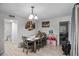 Cozy dining area with stylish table and chairs, complemented by wood-look floors at 1100 H St, Las Vegas, NV 89106