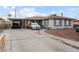Charming single-story home featuring a spacious driveway and covered parking at 1100 H St, Las Vegas, NV 89106