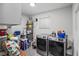 Functional laundry room features modern washer and dryer, water heater, and ample storage solutions at 1100 H St, Las Vegas, NV 89106
