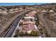 A high-angle view captures a neighborhood featuring an array of well-maintained homes with desert landscaping and a mountain backdrop at 1809 Prichard Ave, Henderson, NV 89052