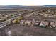 A high-angle view captures a neighborhood featuring homes with desert landscaping and a city and mountain backdrop at 1809 Prichard Ave, Henderson, NV 89052