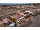 A high-angle view captures a neighborhood featuring homes with desert landscaping and a mountain backdrop with road access at 1809 Prichard Ave, Henderson, NV 89052