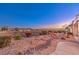 Scenic backyard showcasing desert landscaping, mature plants, and mountain views at 1809 Prichard Ave, Henderson, NV 89052