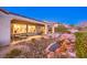 Backyard featuring rock features, professional landscaping, covered patio and outdoor seating at 1809 Prichard Ave, Henderson, NV 89052