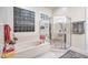 Modern bathroom featuring a soaking tub, separate shower, and window at 1809 Prichard Ave, Henderson, NV 89052