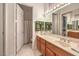 Bright bathroom with a wide mirror, double sink, and decorative green towels at 1809 Prichard Ave, Henderson, NV 89052