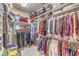 Walk-in closet fully stocked with hanging clothes and shelving for storage at 1809 Prichard Ave, Henderson, NV 89052