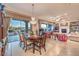 Elegant dining room with chandelier, mountain views, and seamless access to the living area at 1809 Prichard Ave, Henderson, NV 89052