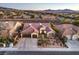 Charming single-story home featuring a terracotta roof, a three-car garage, desert landscaping, and a tranquil neighborhood view at 1809 Prichard Ave, Henderson, NV 89052