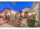 Front entrance featuring elegant double doors, manicured bushes, and desert landscaping at 1809 Prichard Ave, Henderson, NV 89052