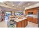 Well-appointed kitchen featuring stainless steel appliances, a large island, and seamless access to the dining area at 1809 Prichard Ave, Henderson, NV 89052