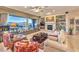 Bright living room featuring a fireplace, built-in shelving, and a large window with mountain views at 1809 Prichard Ave, Henderson, NV 89052