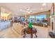 Bright living room featuring a fireplace, built-in shelving, and a large window with mountain views at 1809 Prichard Ave, Henderson, NV 89052