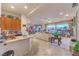 Open concept living space with breakfast bar, living room, and panoramic backyard view at 1809 Prichard Ave, Henderson, NV 89052