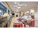 Spacious living room featuring a fireplace, large windows, and comfortable seating area at 1809 Prichard Ave, Henderson, NV 89052