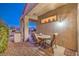 Cozy covered patio with an outdoor dining area and built-in grill at 1809 Prichard Ave, Henderson, NV 89052