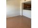 Spacious living room with adjacent kitchen area and neutral paint at 2060 Rancho Lake Dr # 202, Las Vegas, NV 89108