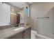 Well-lit bathroom featuring a large mirror, modern fixtures, and a separate shower area at 2171 King Crest Ct, Henderson, NV 89052