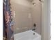 Tiled tub and shower featuring neutral colors at 2171 King Crest Ct, Henderson, NV 89052