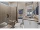 Modern bathroom featuring a walk-in shower with a glass door and a sleek vanity with ample storage at 2171 King Crest Ct, Henderson, NV 89052