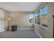 Bedroom with plush carpeting, a table lamp, and a large window offering beautiful views at 2171 King Crest Ct, Henderson, NV 89052