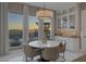 Bright dining area features large windows with city and mountain views plus stylish decor at 2171 King Crest Ct, Henderson, NV 89052