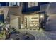 Beautiful home featuring a private courtyard with stone accents and upgraded lighting fixtures at 2171 King Crest Ct, Henderson, NV 89052