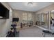 Home gym with a mounted TV, two large mirrors, and ample storage space for equipment at 2171 King Crest Ct, Henderson, NV 89052
