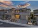 Beautiful modern home showcasing landscaped yard and a spacious driveway with excellent curb appeal at 2171 King Crest Ct, Henderson, NV 89052