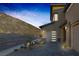 Modern two-story home with a gray color scheme, a two-car garage, and professional landscaping at 2171 King Crest Ct, Henderson, NV 89052