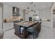 Modern kitchen features a large center island, stainless appliances, and sleek cabinetry at 2171 King Crest Ct, Henderson, NV 89052